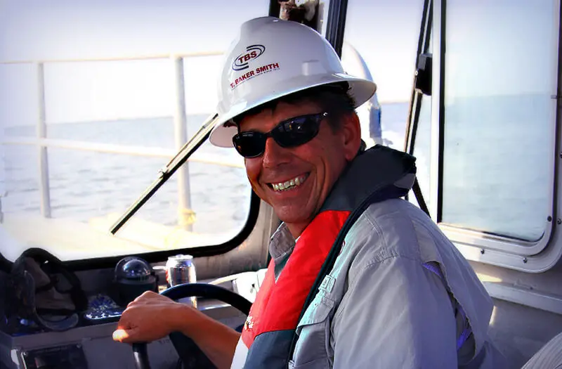 CEO Kenny driving boat