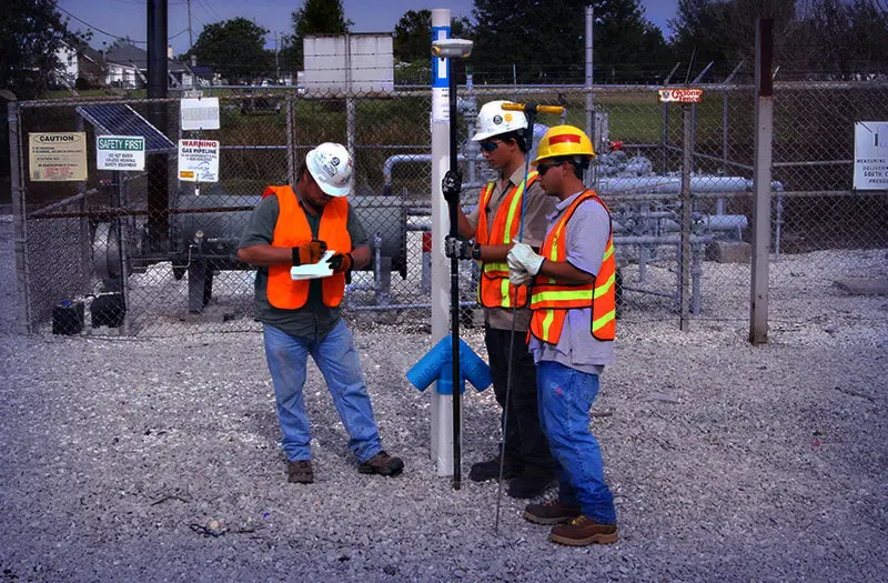Men installing pipeline equipment
